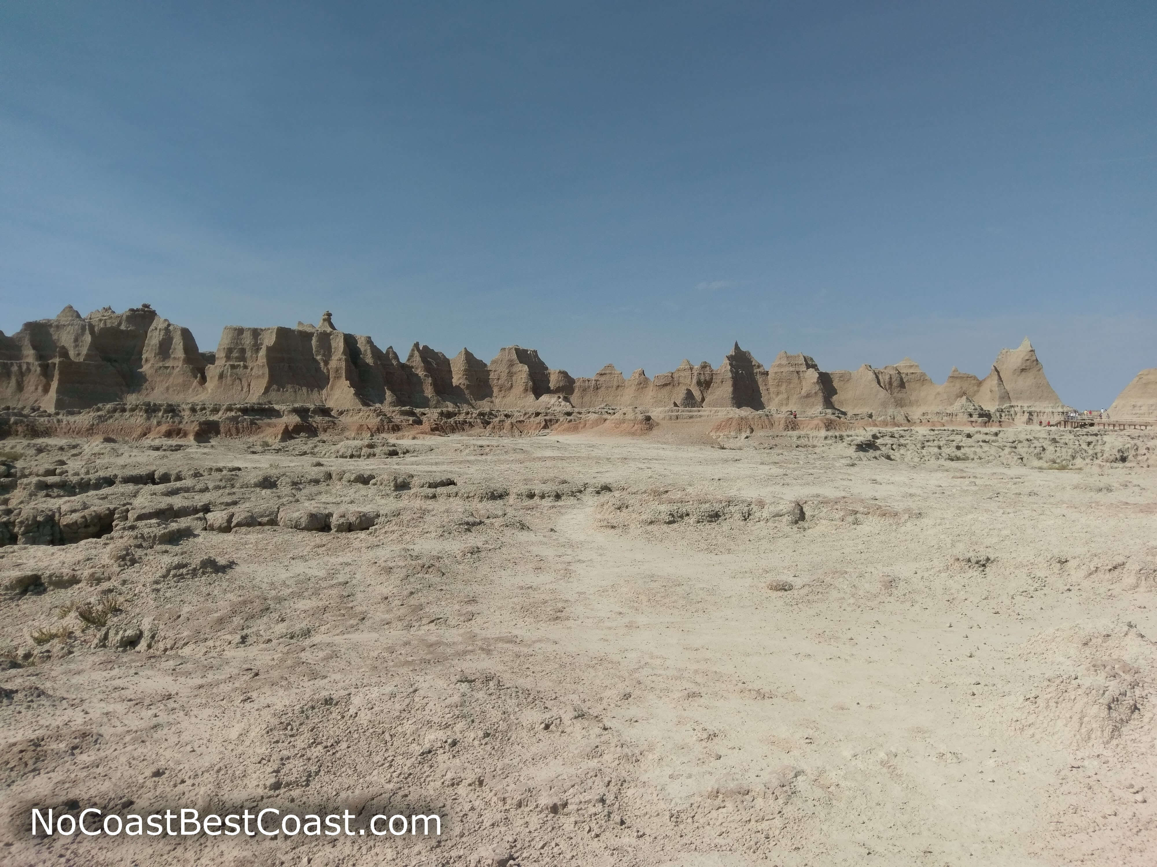 Looking back at the fortress-like wall of badlands formation