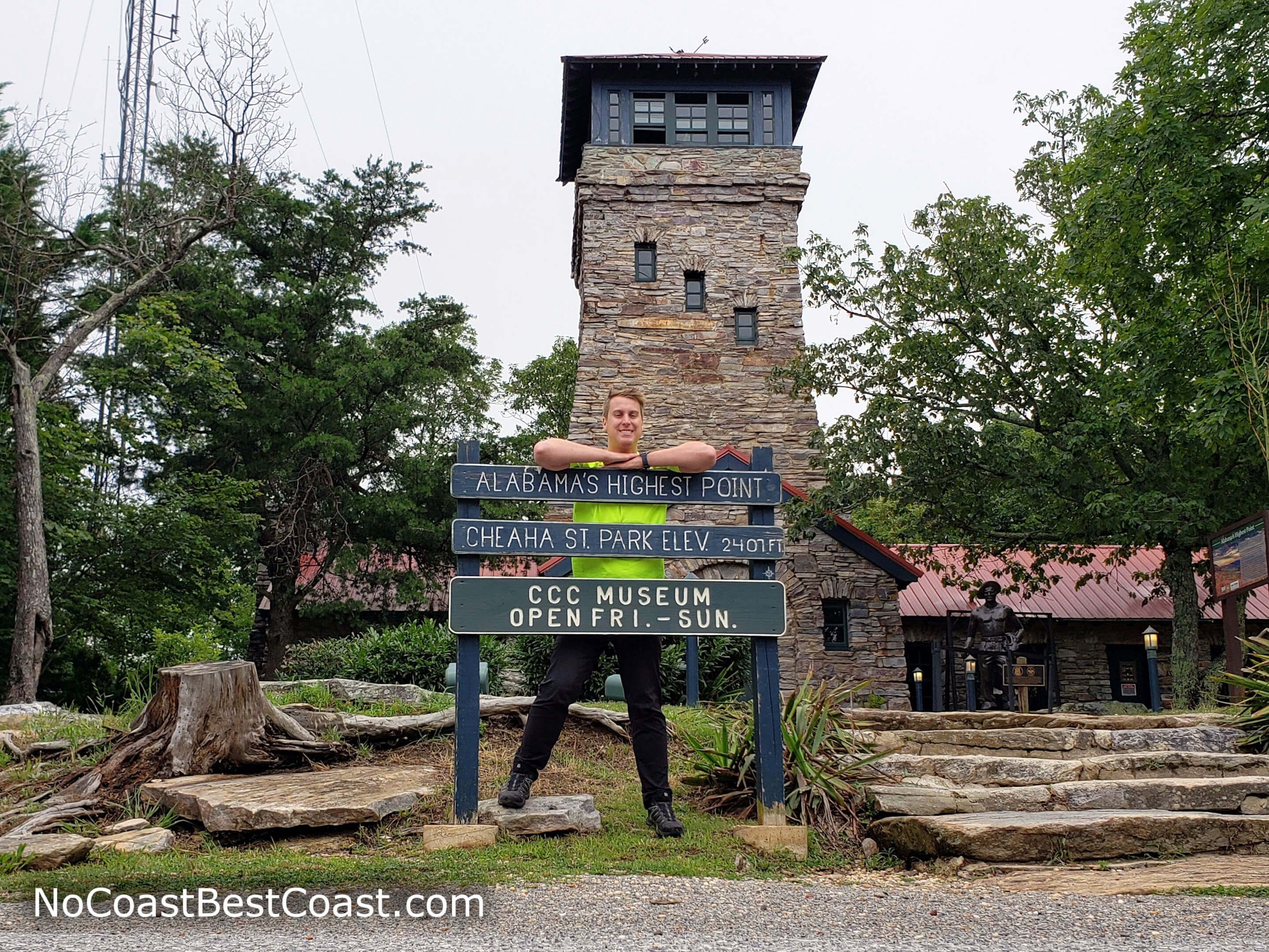 The sign, observation tower, and CCC Museum at the summit of Cheaha Mountain