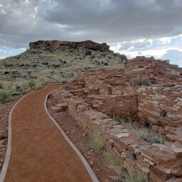 Citadel Pueblo on top of the hill with Nalakihu Pueblo in the foreground