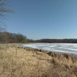 A view across the partially frozen Goose Lake.