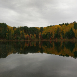 Cloudy skies and fall colors from the dock on Pickerel Lake