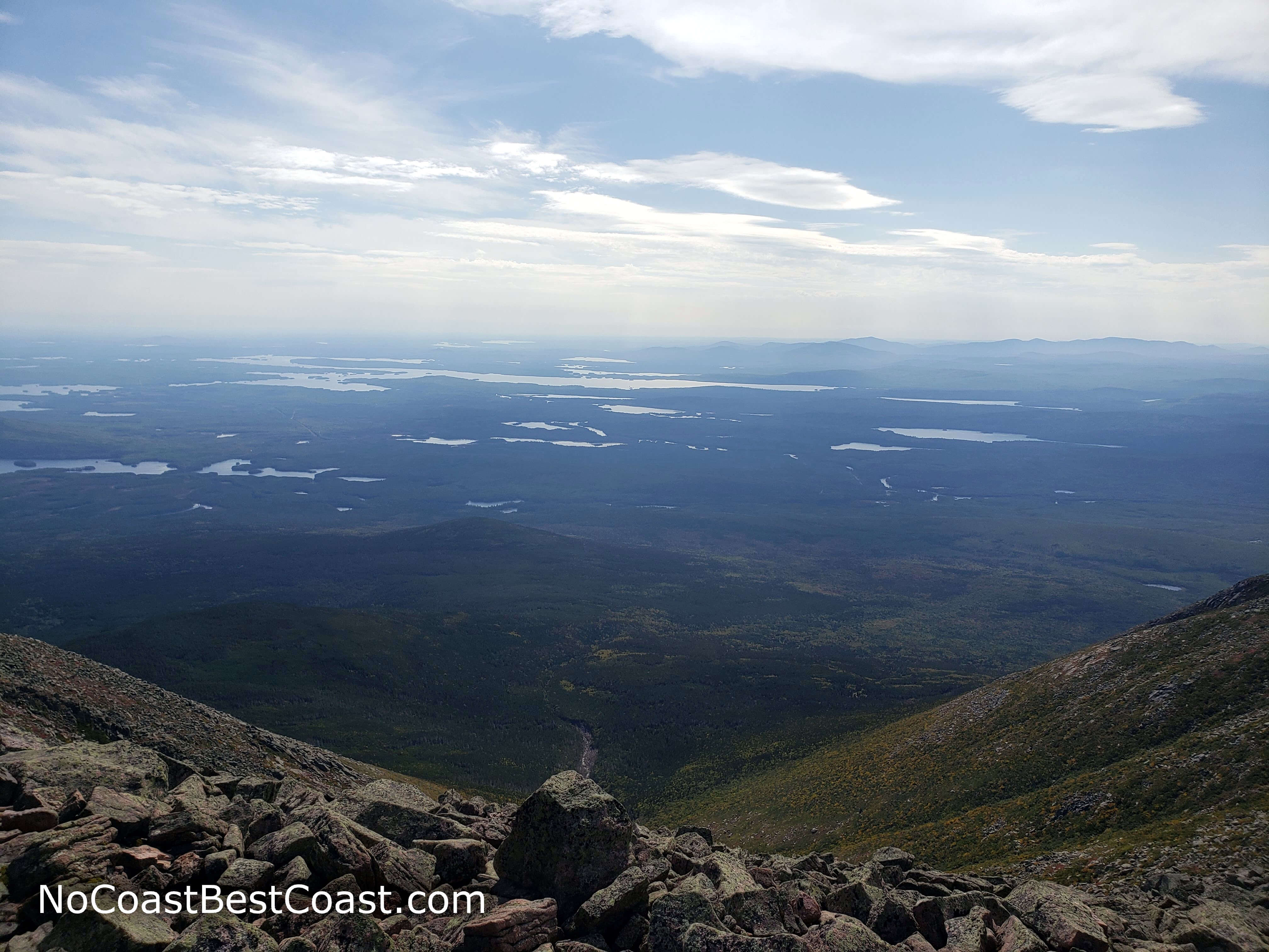 Looking south from the summit at the many lakes and distant mountains of Maine