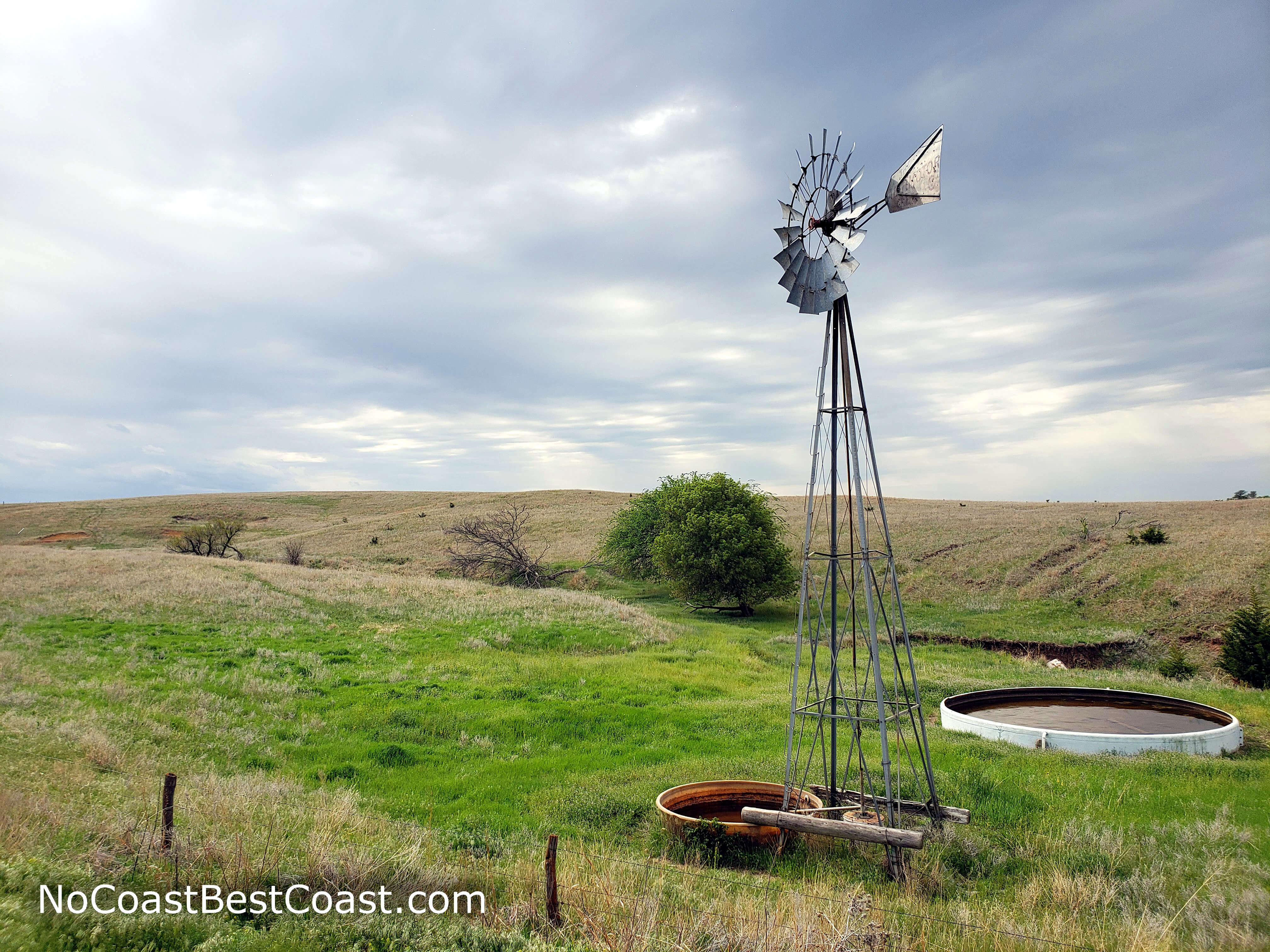 A very Kansas scene of windmill and rolling prairie