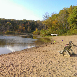 The sandy swimming beach on Lake Alice