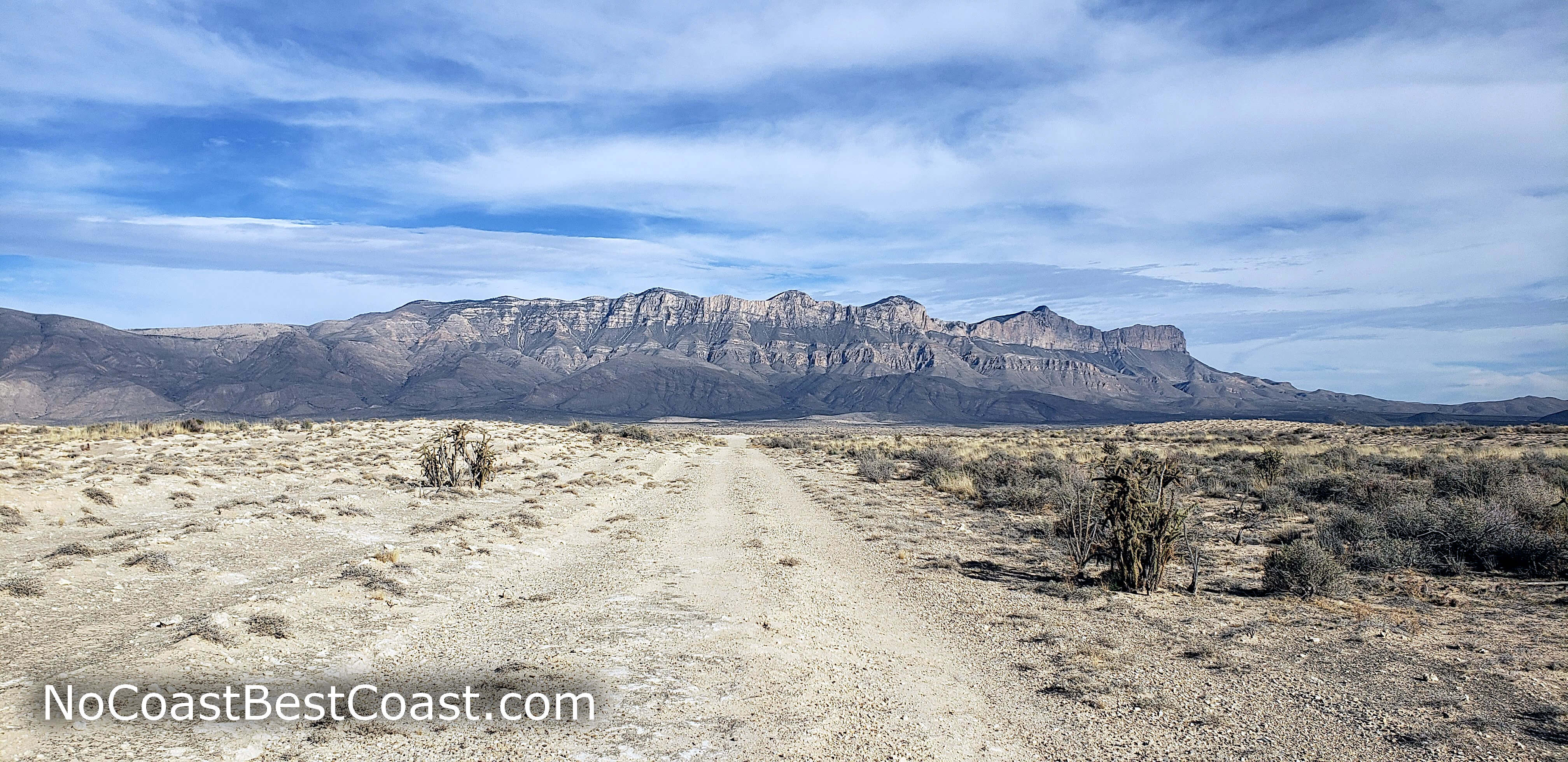 The Guadalupe Mountains rising above the desert as seen from the old road