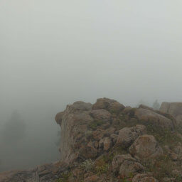 Fog dowsing the rock formations at the summit of Sheepnose Mountain