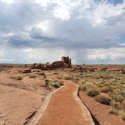 Wukoki Pueblo rising above the desert as seen from the start of the trail